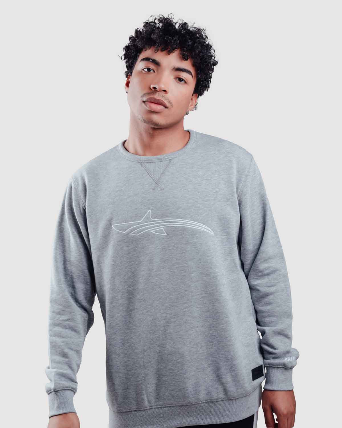 Model wearing a grey pull over sweater from oceanman - bali edition
