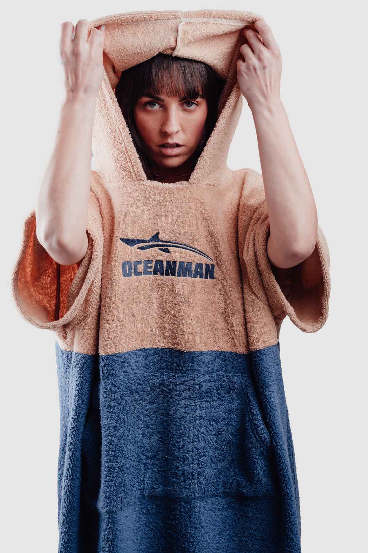 woman covering head with poncho