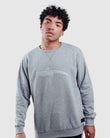 Model wearing a grey pull over sweater from oceanman - bali edition